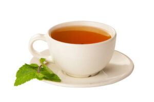 chamomile tea in a cup with white background.