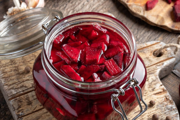 Preparation of beet kvass - fermented red beets, in a glass jar