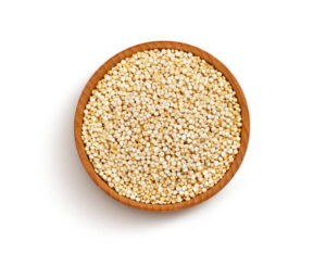 Wooden bowl of quinoa seeds isolated on white background with clipping path, close up, top view