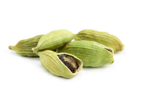 Pile of whole cardamom isolated on white background