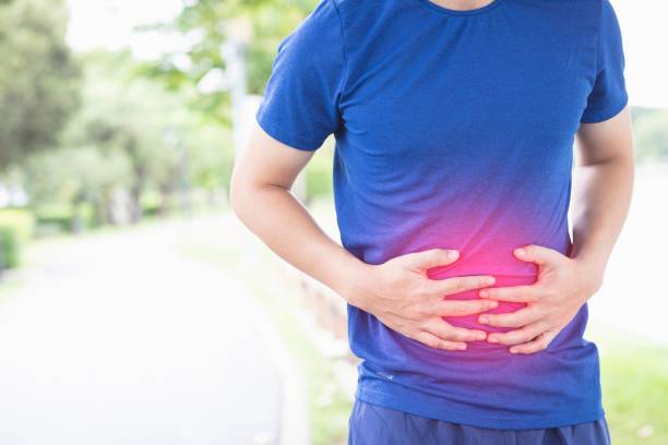 image of man use hands to catch the stomach